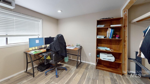 office with wood finished floors and baseboards