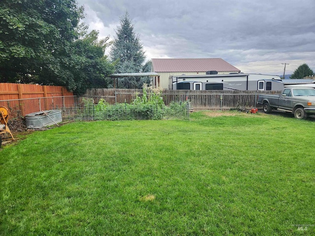 view of yard with a fenced backyard