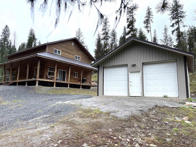 view of front of house with an outdoor structure and a garage