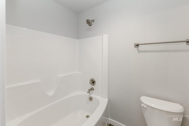 bathroom with toilet and shower / tub combination