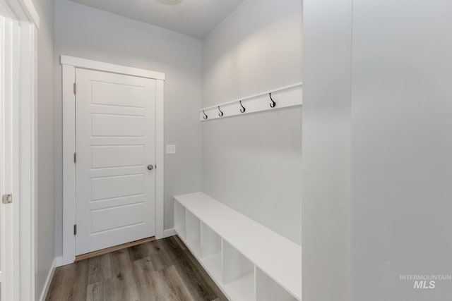 mudroom featuring baseboards and wood finished floors