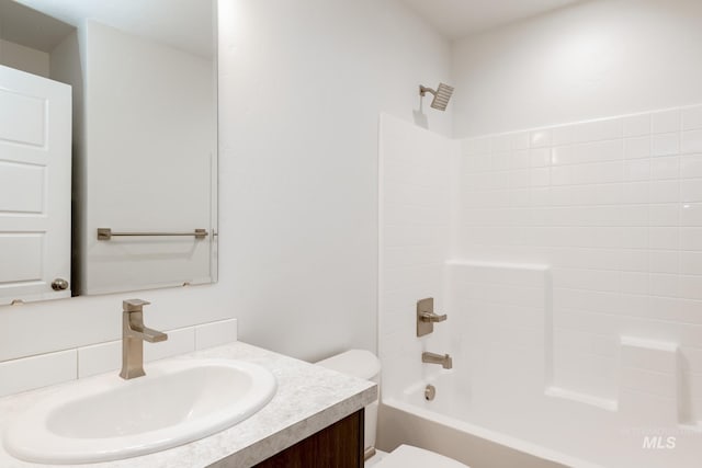 full bath with toilet, vanity, and  shower combination