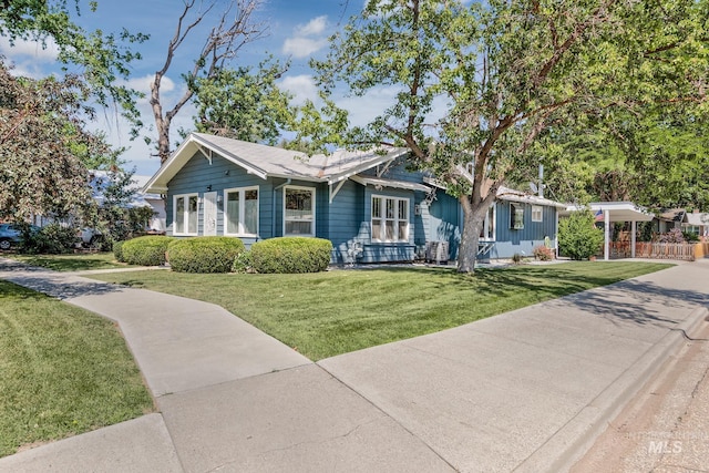 300 N 10th St, Payette, ID 83661 - view of front of property featuring a front lawn and a carport