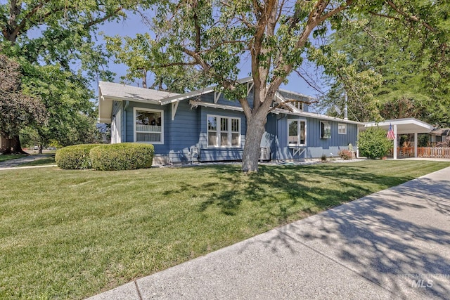 300 N 10th St, Payette, ID 83661 - view of front of house with board and batten siding and a front lawn