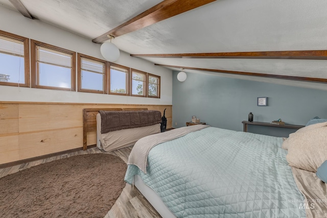 300 N 10th St, Payette, ID 83661 - bedroom featuring beamed ceiling and wood finished floors