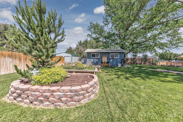 300 N 10th St, Payette, ID 83661 - fenced backyard with an outdoor structure and a vegetable garden