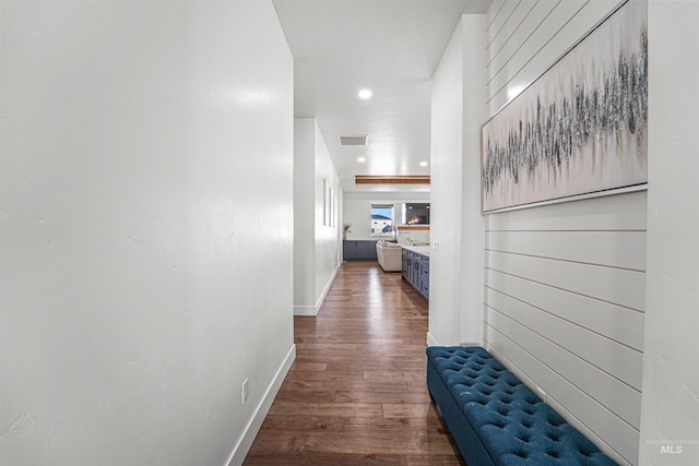 corridor featuring visible vents, recessed lighting, baseboards, and wood finished floors