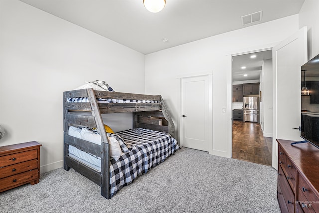 bedroom with visible vents, black fridge, recessed lighting, carpet, and stainless steel fridge with ice dispenser