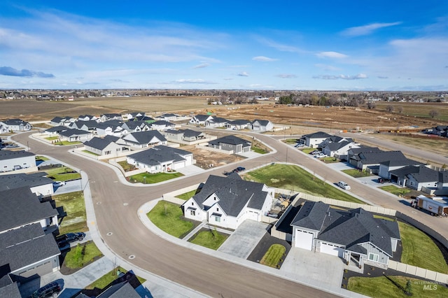 birds eye view of property with a residential view