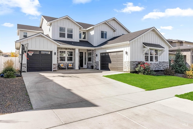 view of front of home featuring a garage and a front yard