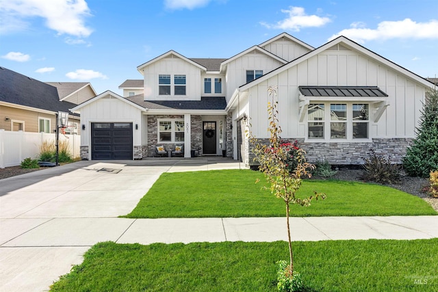 view of front of home with a garage and a front lawn