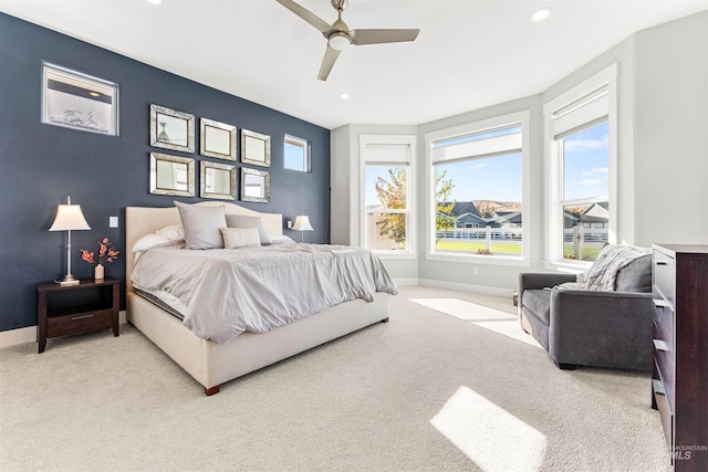 carpeted bedroom featuring ceiling fan