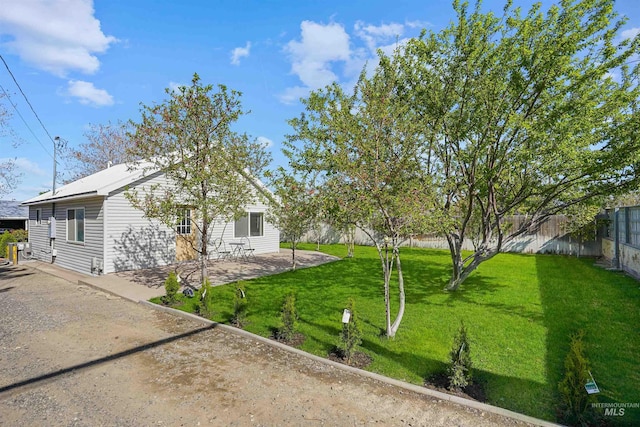 exterior space with fence and a patio area
