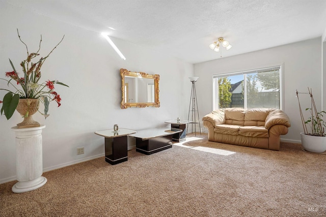 carpeted living area with baseboards