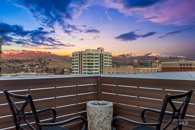 balcony at dusk with a mountain view