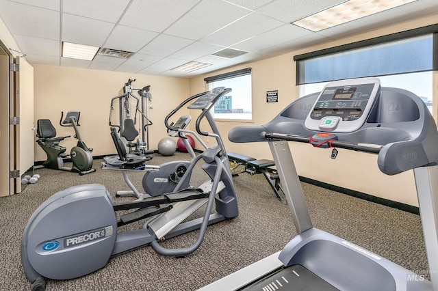 gym featuring a drop ceiling and visible vents