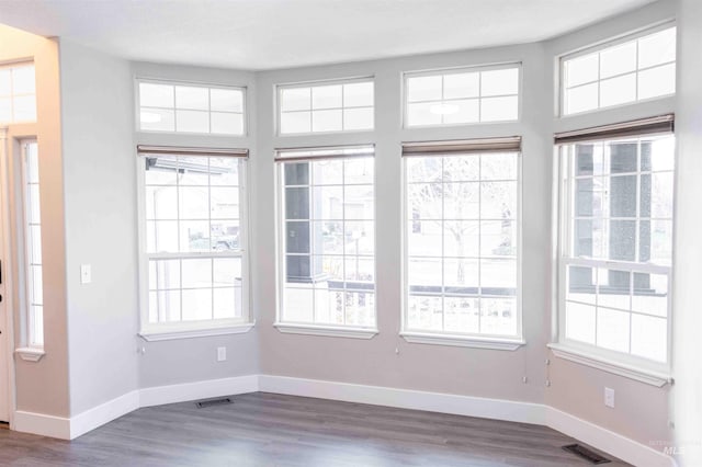 unfurnished sunroom featuring a healthy amount of sunlight