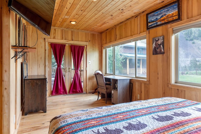 bedroom featuring multiple windows, light wood-type flooring, and wood ceiling