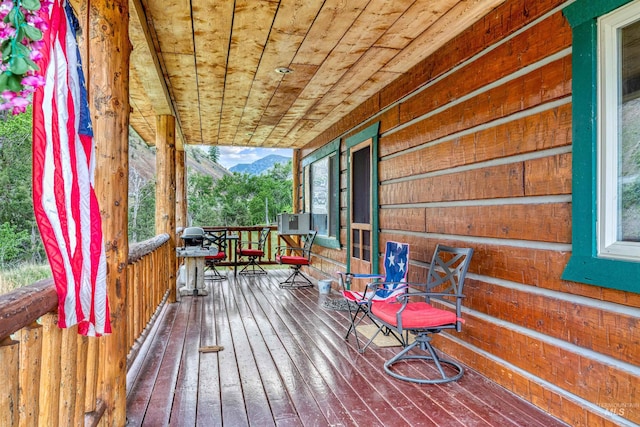 wooden deck with a mountain view