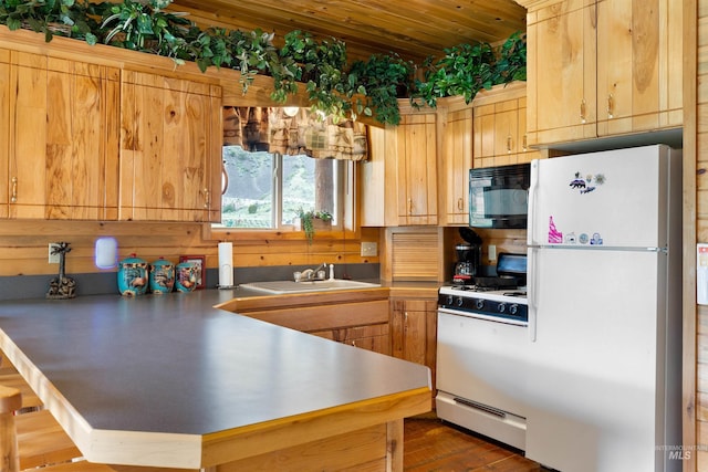 kitchen with sink and white appliances