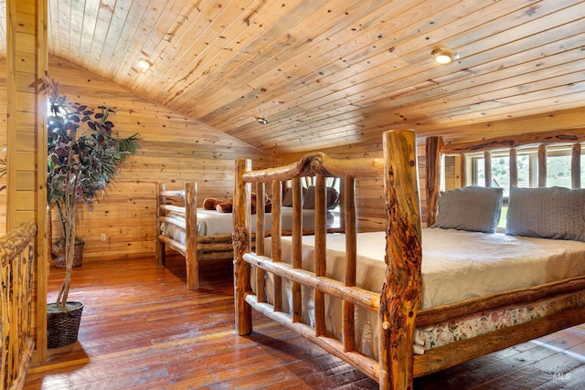 bedroom with vaulted ceiling, hardwood / wood-style flooring, and wood ceiling