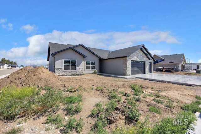 1552 W Ruby, Rupert, ID 83350 - single story home featuring stone siding, an attached garage, driveway, and stucco siding