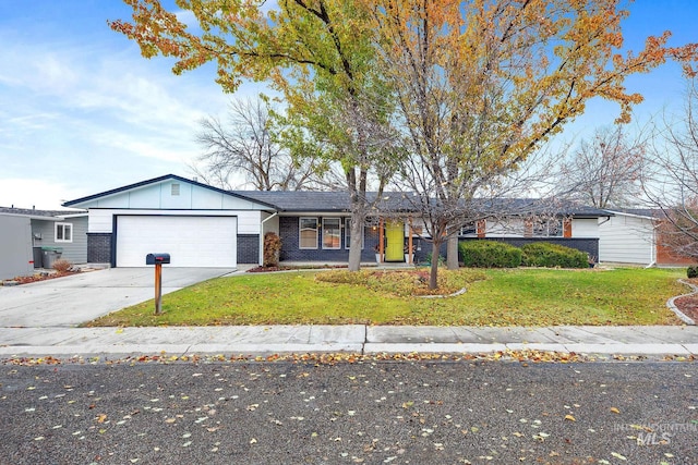 ranch-style home with a front lawn and a garage