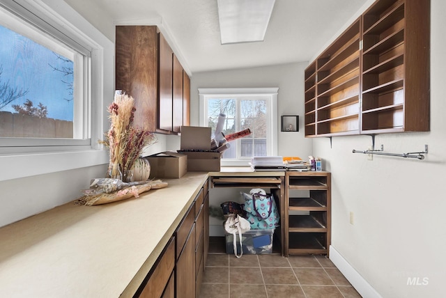 laundry area with tile patterned floors