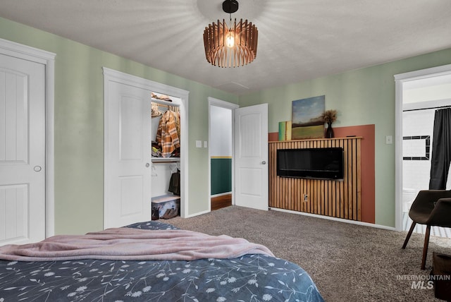 carpeted bedroom featuring a textured ceiling