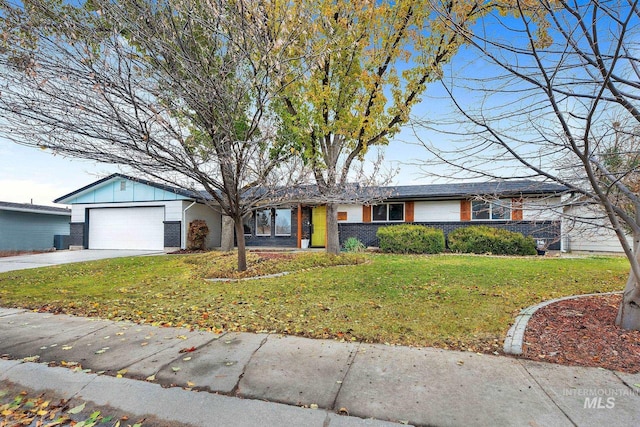 ranch-style house featuring central air condition unit, a front lawn, and a garage