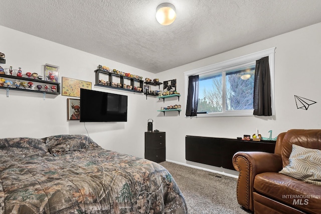 carpeted bedroom with a textured ceiling