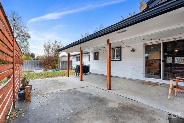 view of patio with a grill