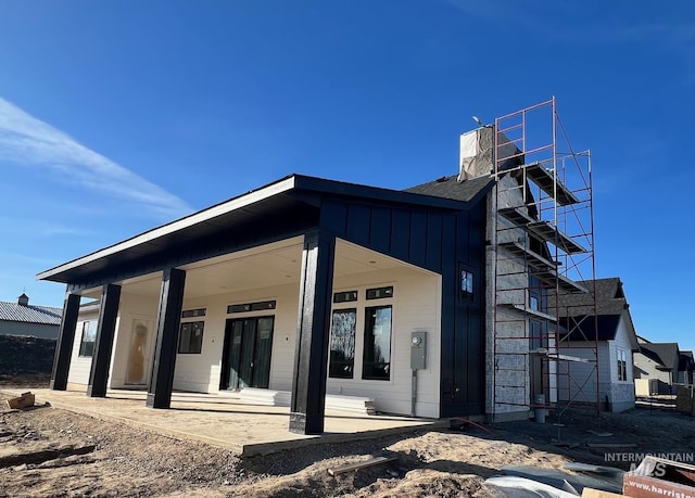 exterior space featuring a patio area and board and batten siding