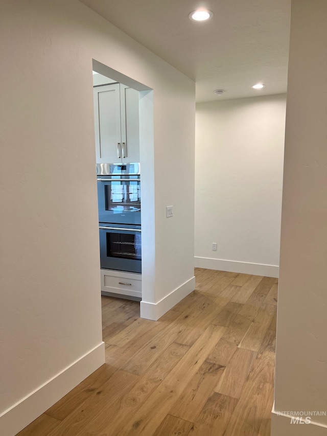 3075 N Costa Madera Ave, Star, ID 83669 - corridor featuring light wood finished floors, baseboards, and recessed lighting