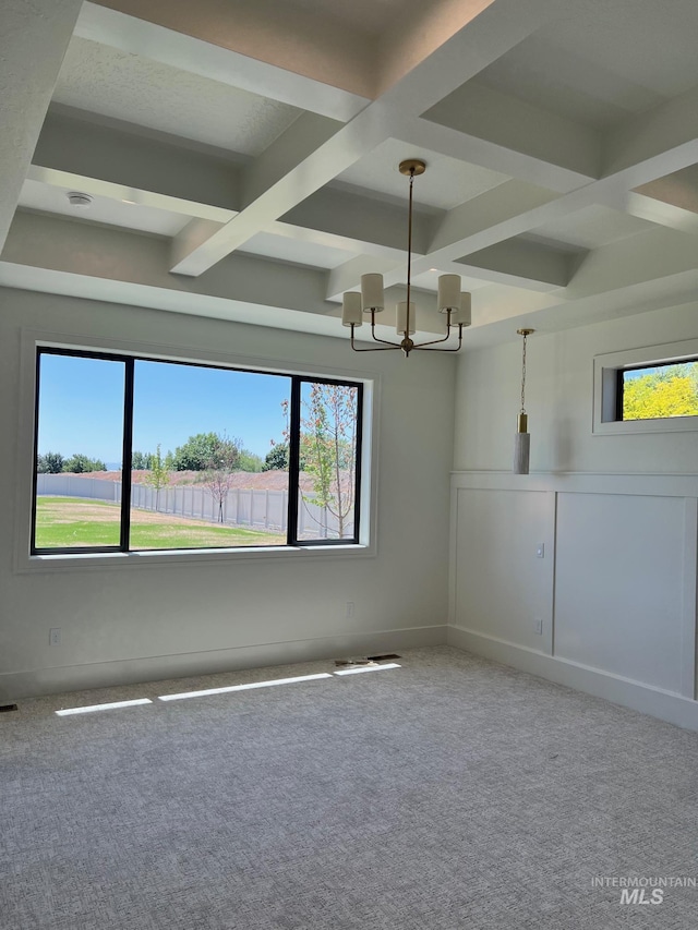 3075 N Costa Madera Ave, Star, ID 83669 - carpeted spare room with coffered ceiling, a chandelier, healthy amount of natural light, and beamed ceiling