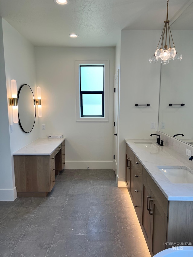3075 N Costa Madera Ave, Star, ID 83669 - bathroom featuring baseboards, double vanity, and recessed lighting