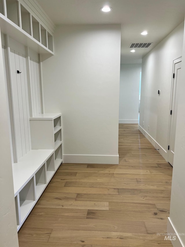 3075 N Costa Madera Ave, Star, ID 83669 - mudroom with light wood-style flooring, recessed lighting, and baseboards