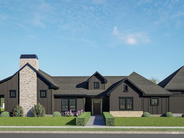 view of front facade featuring a front lawn, board and batten siding, roof with shingles, and a chimney