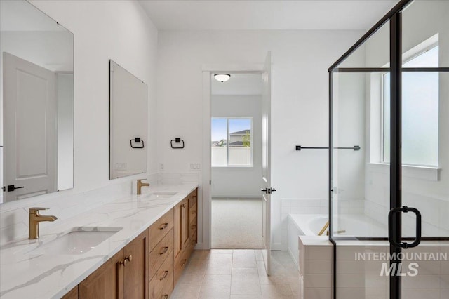 5351 W Mcnair St, Meridian, ID 83646 - full bath with double vanity, a bath, a shower stall, and tile patterned floors