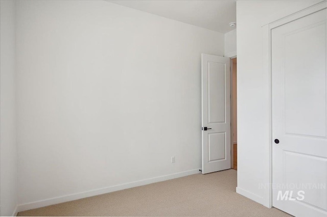 5351 W Mcnair St, Meridian, ID 83646 - unfurnished bedroom with light carpet, baseboards, and a closet