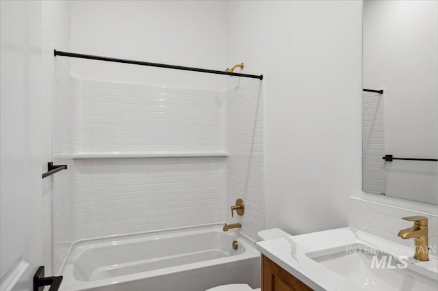 5351 W Mcnair St, Meridian, ID 83646 - bathroom with vanity, washtub / shower combination, toilet, and decorative backsplash