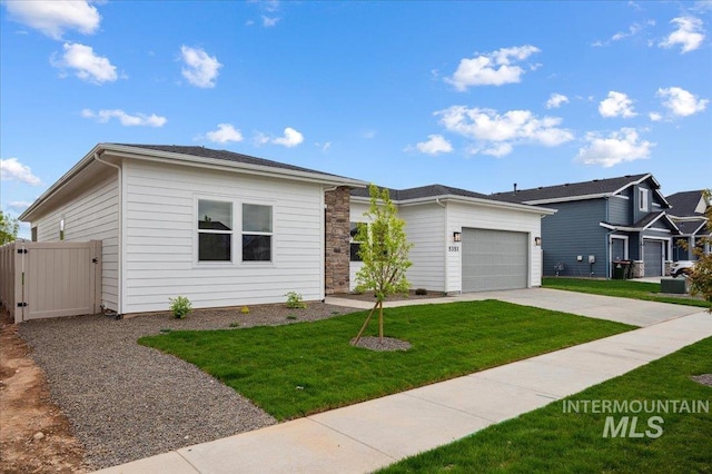 5351 W Mcnair St, Meridian, ID 83646 - view of front of property with a garage, driveway, a front lawn, and a gate