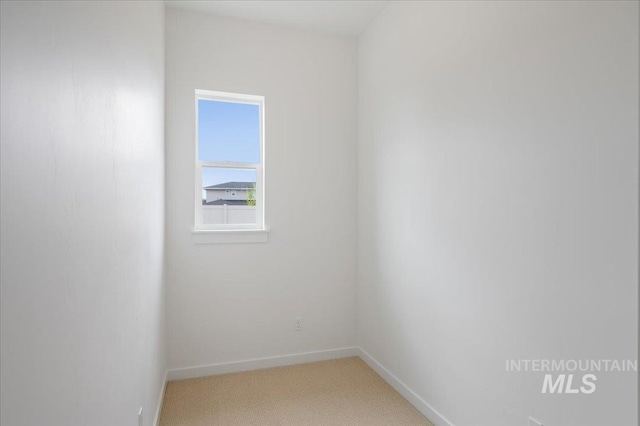 5351 W Mcnair St, Meridian, ID 83646 - unfurnished room with light carpet and baseboards