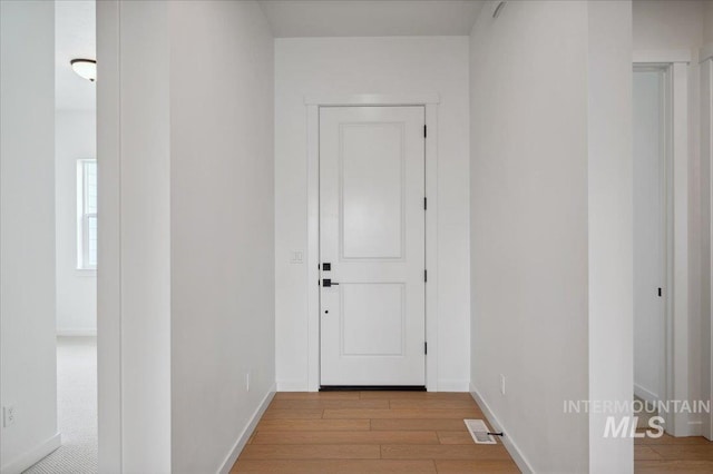 5351 W Mcnair St, Meridian, ID 83646 - hallway with baseboards and wood finished floors