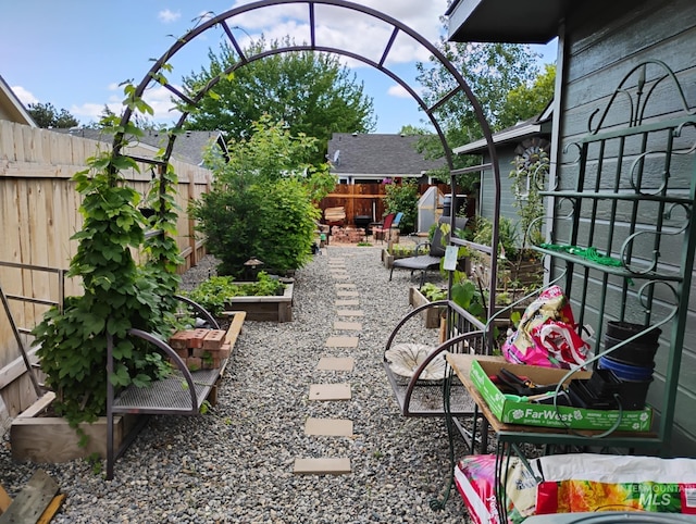fenced backyard featuring a shed and an outdoor structure