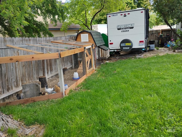 view of yard featuring exterior structure and an outbuilding