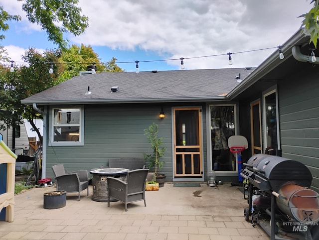 view of patio / terrace featuring a fire pit and a grill