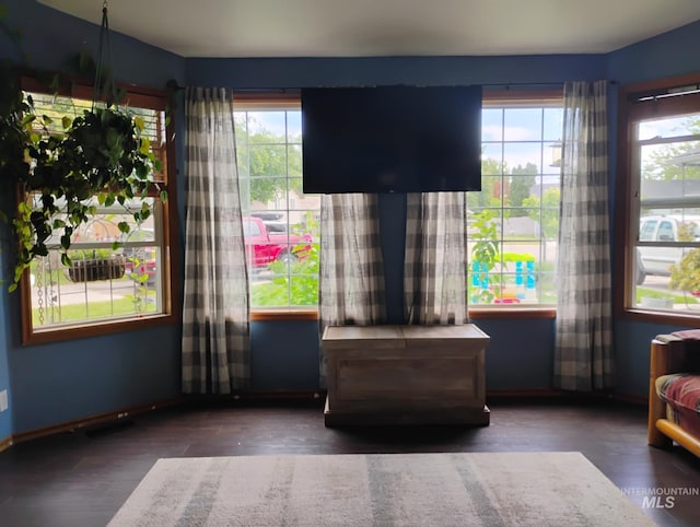 sitting room with wood finished floors and baseboards