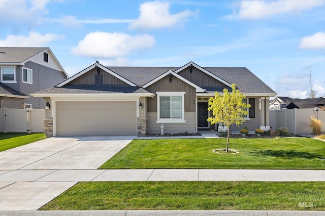 craftsman house with a garage and a front lawn