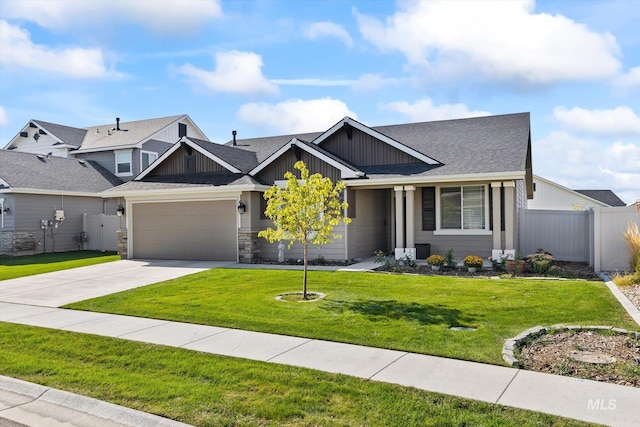 craftsman house featuring a garage and a front yard